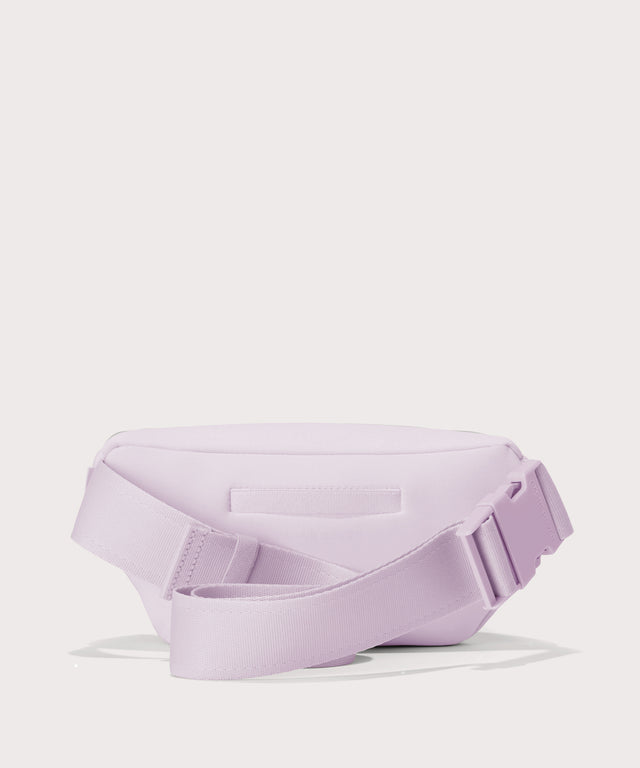 Dagne Dover Ace Fanny Pack in  a soft purple with grey undertones  seen from the back
