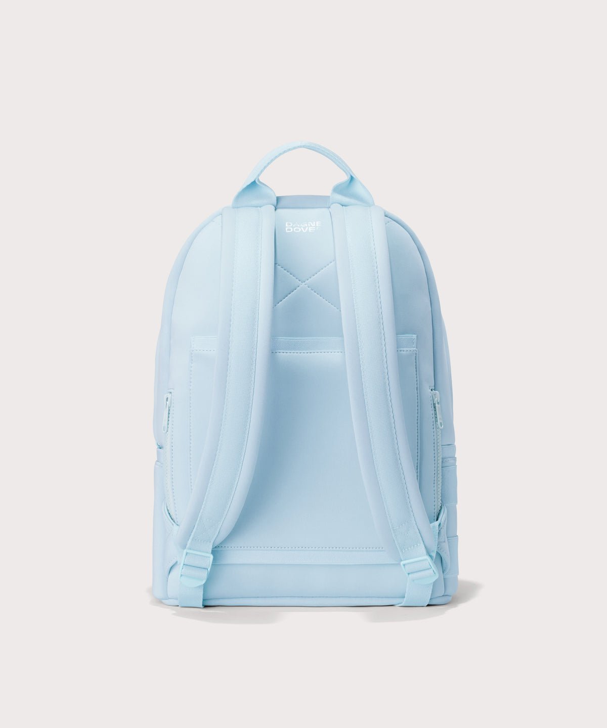 Dagne Dover medium Dakota Neoprene Backpack in an airy, lighter sky blue seen from the back.

