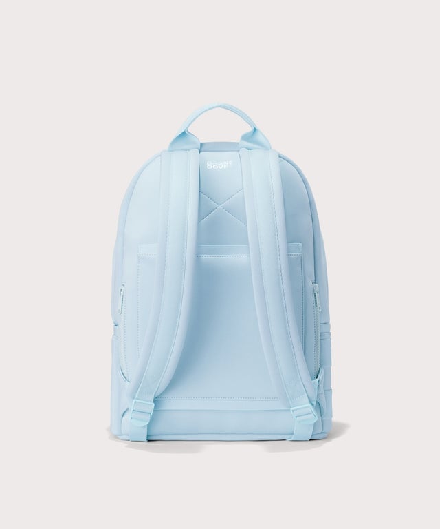 Dagne Dover medium Dakota Neoprene Backpack in an airy, lighter sky blue seen from the back.
