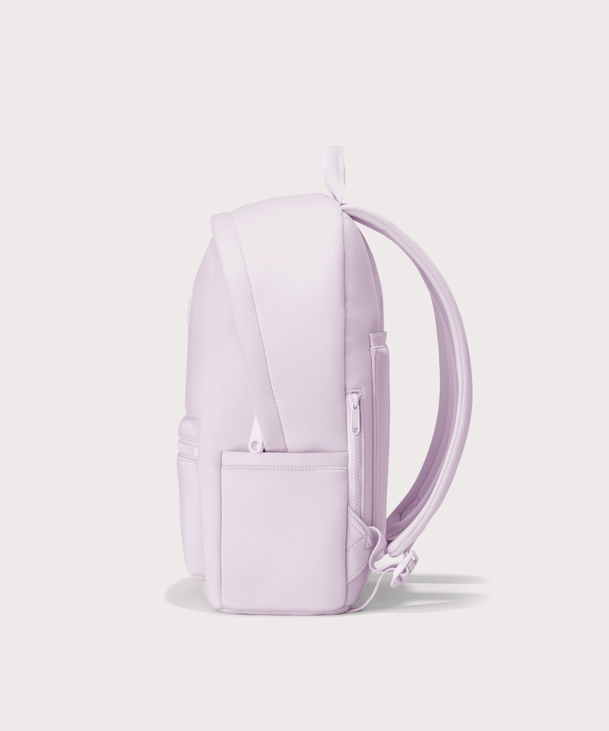 Dagne Dover medium Dakota Neoprene Backpack in a soft purple with grey undertones seen from the side.

