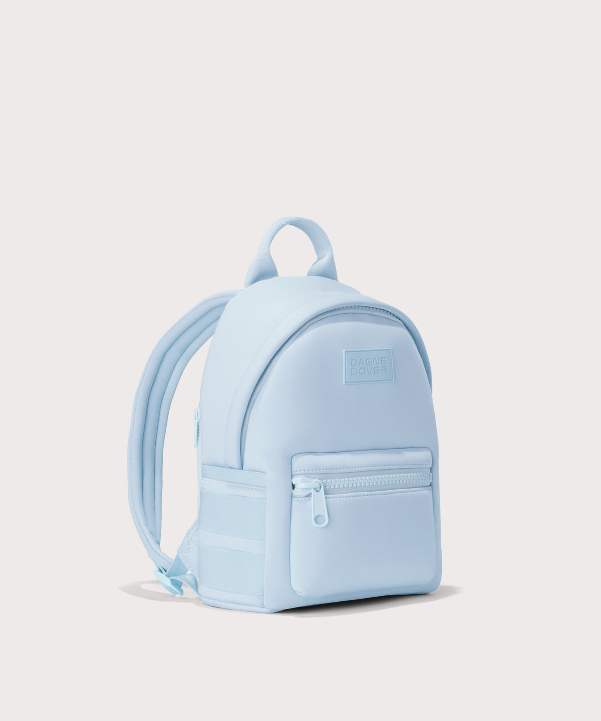 Dagne Dover small Dakota Neoprene Backpack in a airy, lighter sky blue seen from an angle