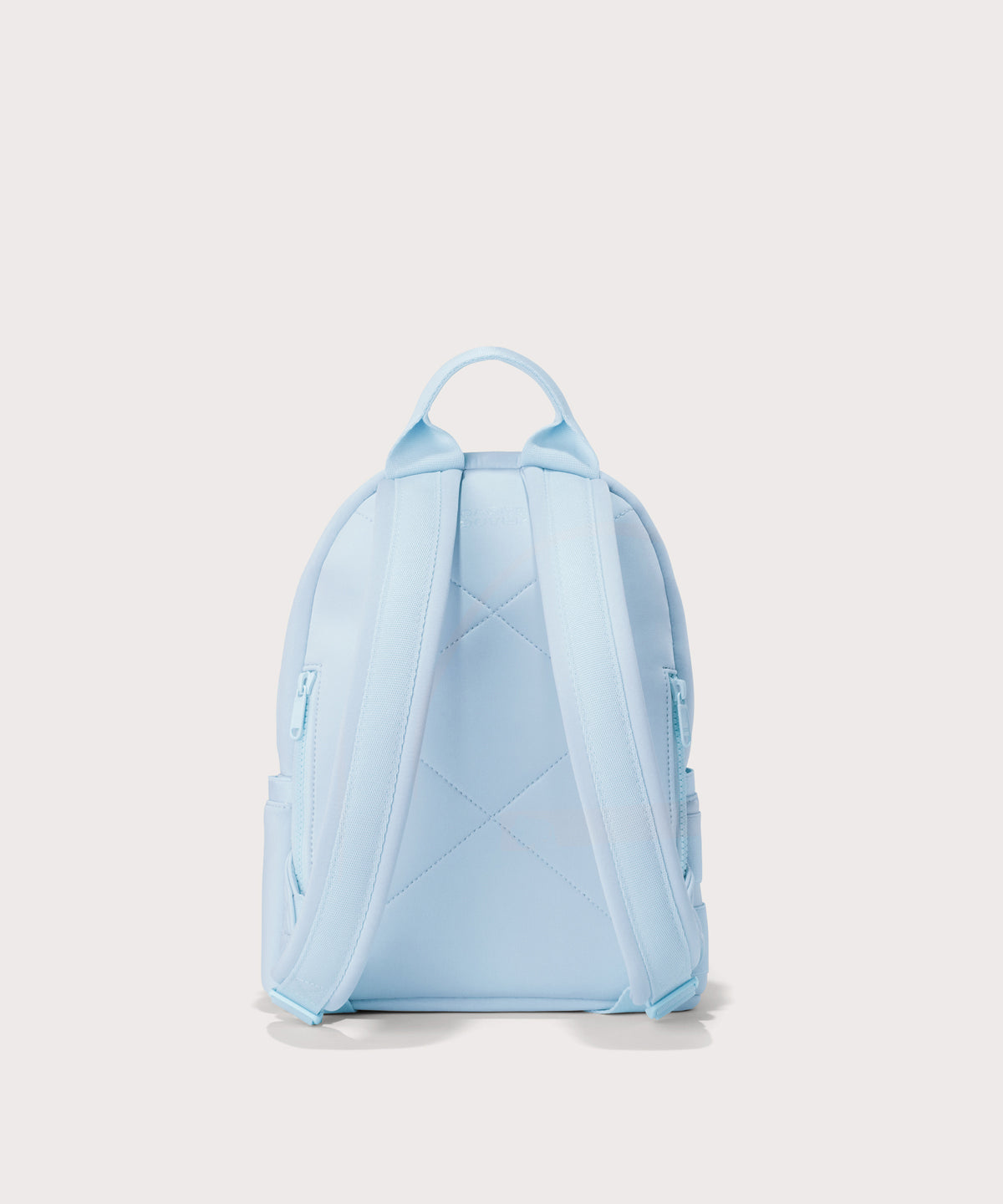 Dagne Dover small Dakota Neoprene Backpack in a airy, lighter sky blue . seen from the back.
