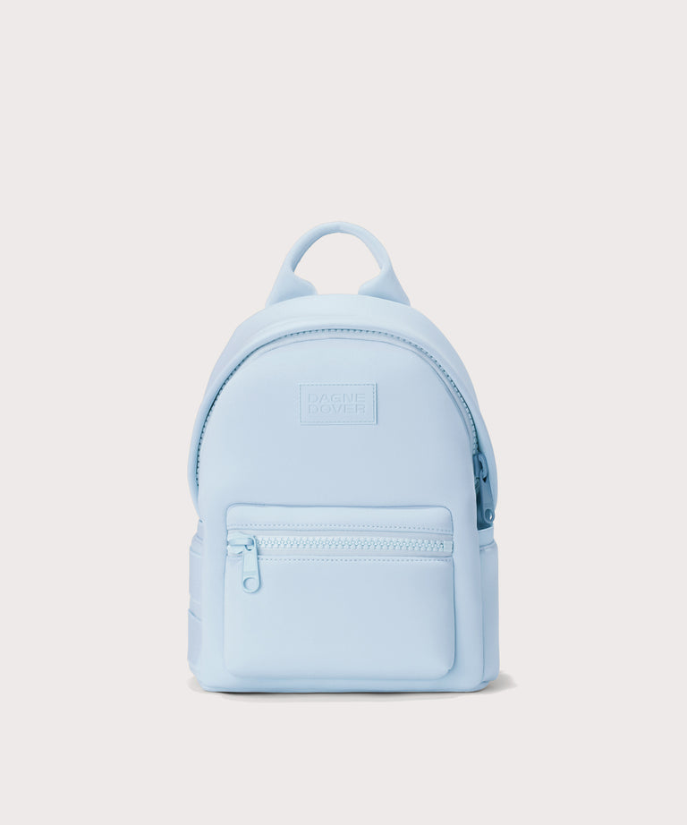 Dagne Dover Dakota Small Neoprene Backpack in a airy, lighter sky blue seen from an angle.