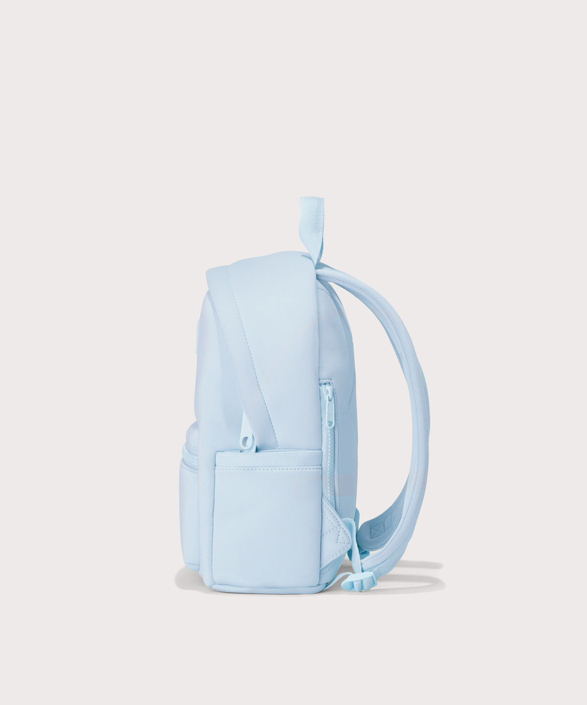 Dagne Dover small Dakota Neoprene Backpack in a airy, lighter sky blue  seen from the side.
