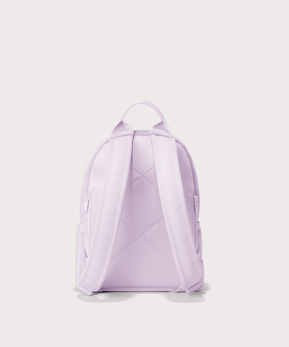 Dagne Dover small Dakota Neoprene Backpack in a soft purple with grey undertones seen from an angle. seen from the back.
