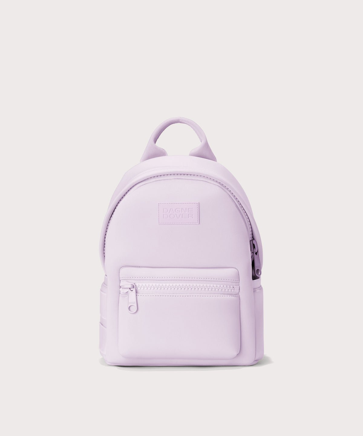 Dagne Dover Dakota Small Neoprene Backpack in a soft purple with grey undertones seen from an angle.