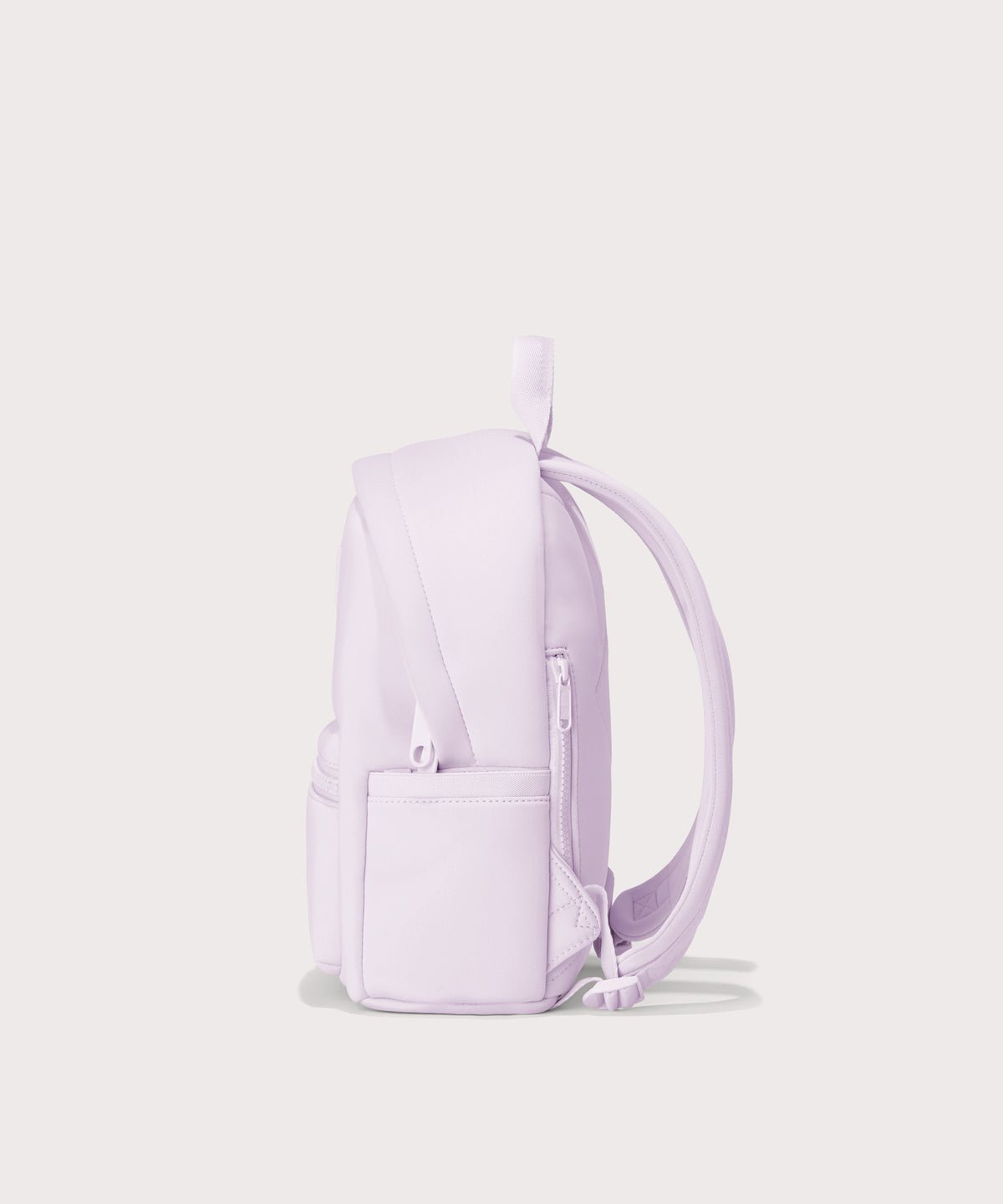 Dagne Dover small Dakota Neoprene Backpack in a soft purple with grey undertones seen from an angle. seen from the side.
