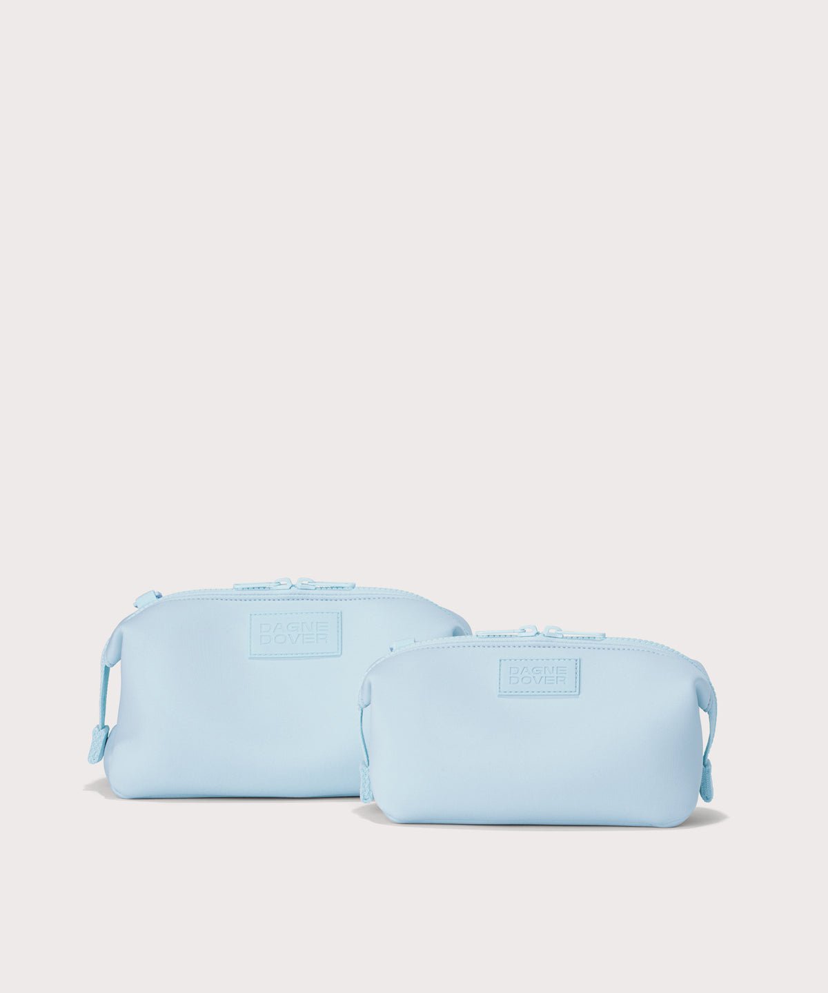 Dagne Dover small and Large Hunter Toiletry Bags in an airy, lighter sky blue.
