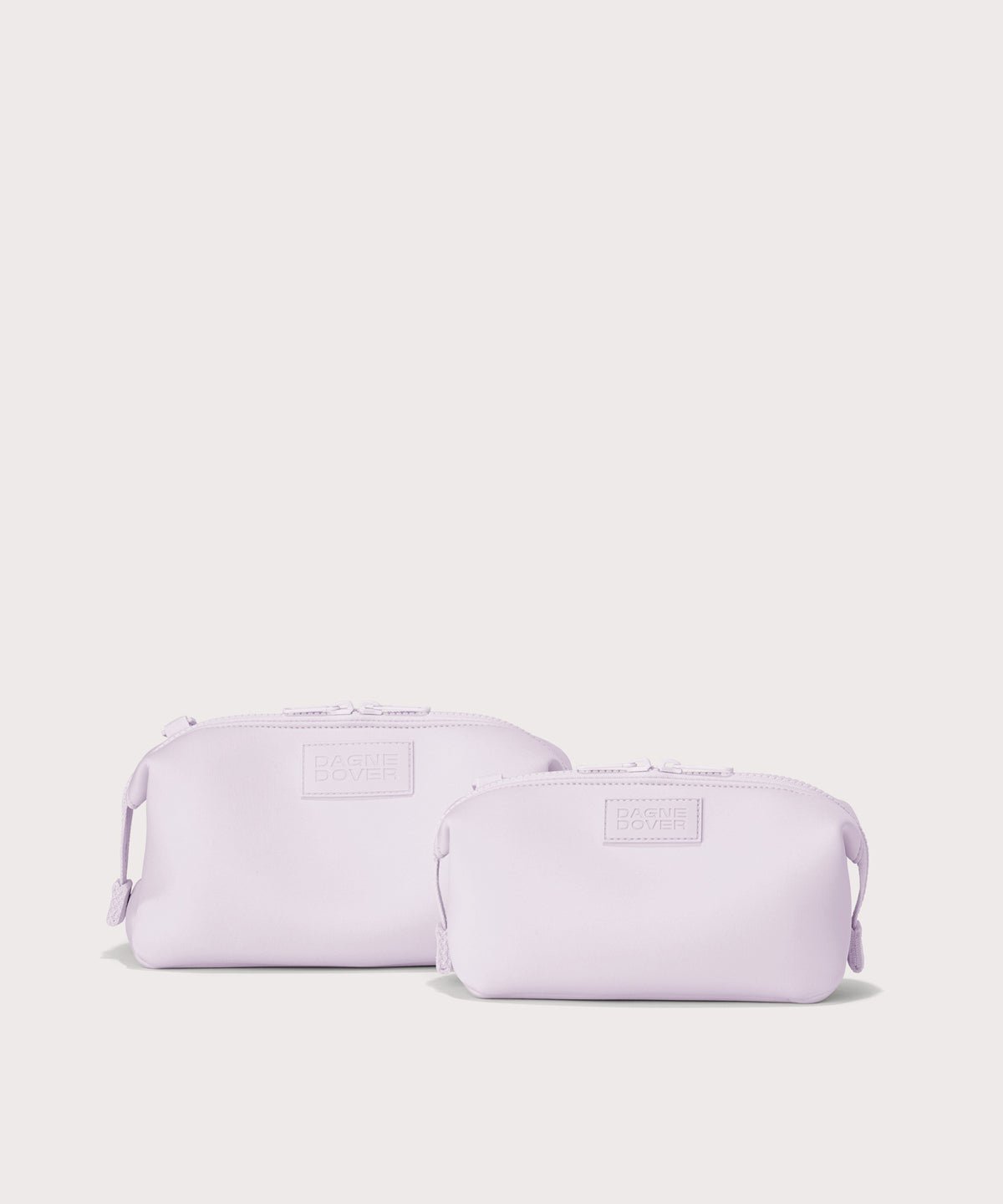 Dagne Dover Small and Large Hunter Toiletry Bags in  a soft purple with grey undertones.

