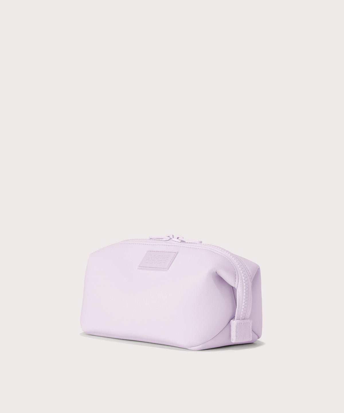 Dagne Dover Small Hunter Toiletry Bag in  a soft purple with grey undertones seen from an angle.
