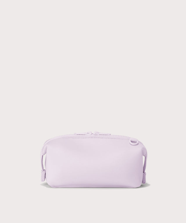 Dagne Dover Small Hunter Toiletry Bag in  a soft purple with grey undertones seen from the back.
