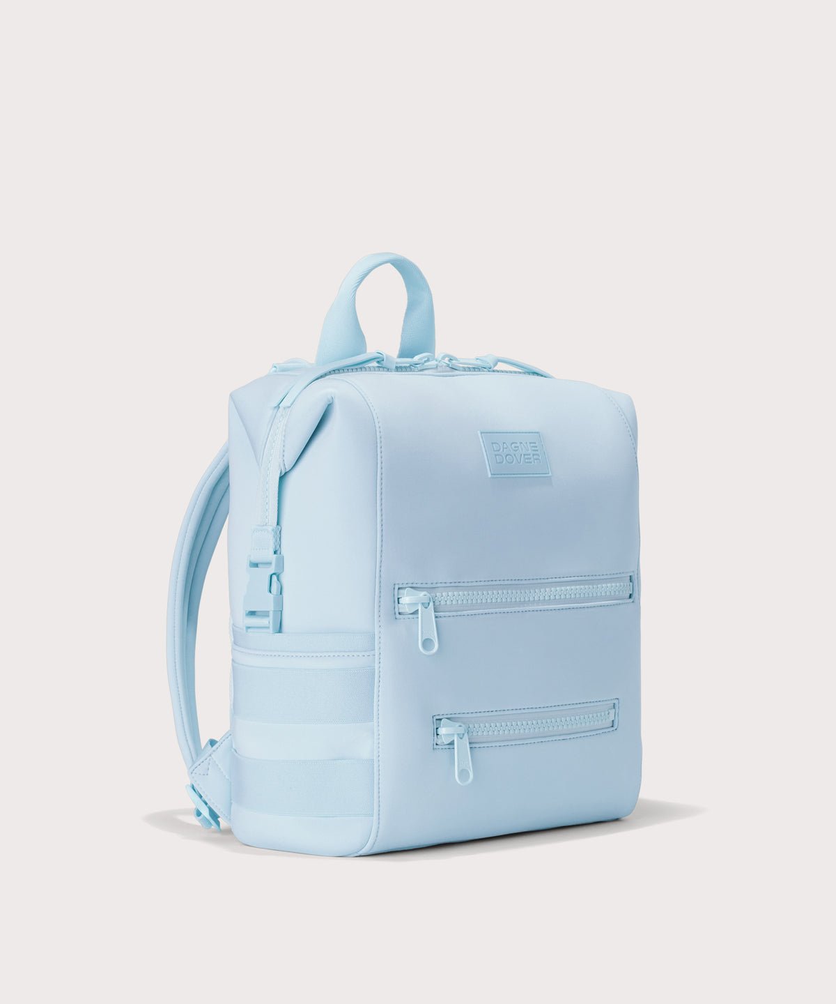 Dagne Dover Medium Indi Diaper Backpack in an airy, lighter sky blue. seen from an angle.
