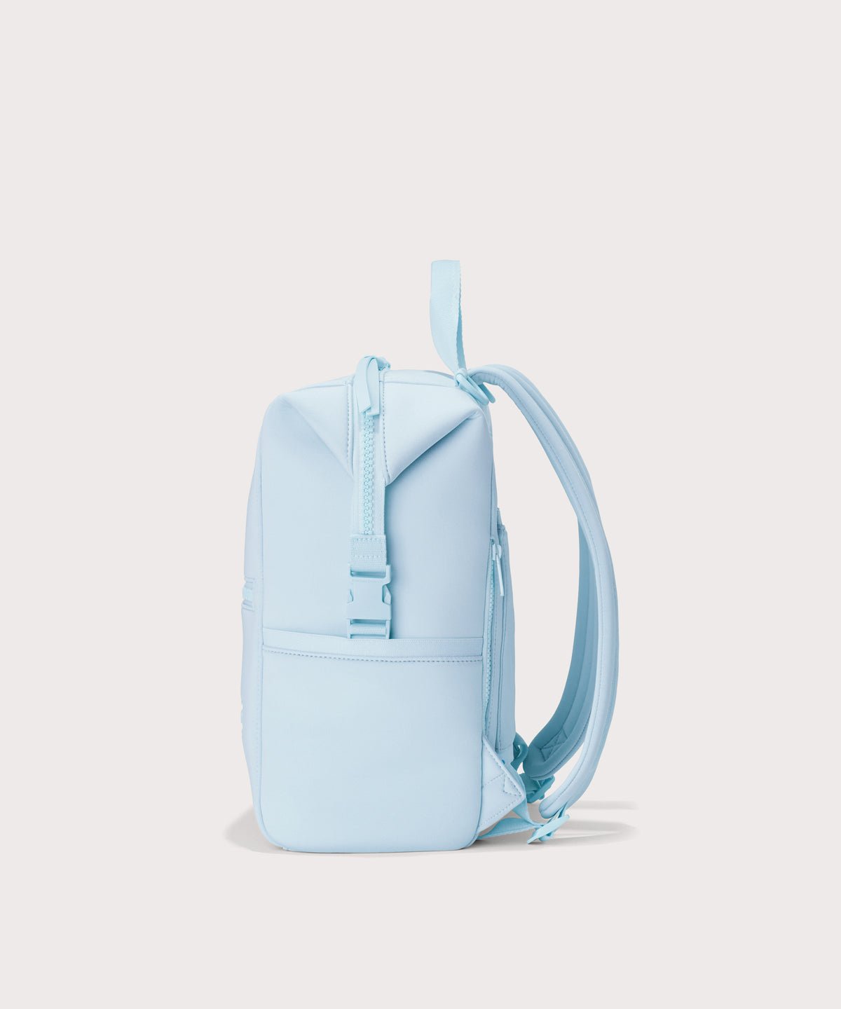 Dagne Dover Medium Indi Diaper Backpack in an airy, lighter sky blue. seen from the side.
