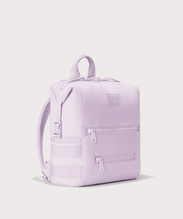Dagne Dover Medium Indi Diaper Backpack in a soft purple with grey undertones seen from an angle.
