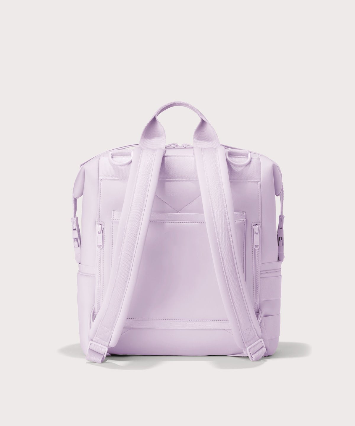 Dagne Dover Medium Indi Diaper Backpack in a soft purple with grey undertones seen from the back.
