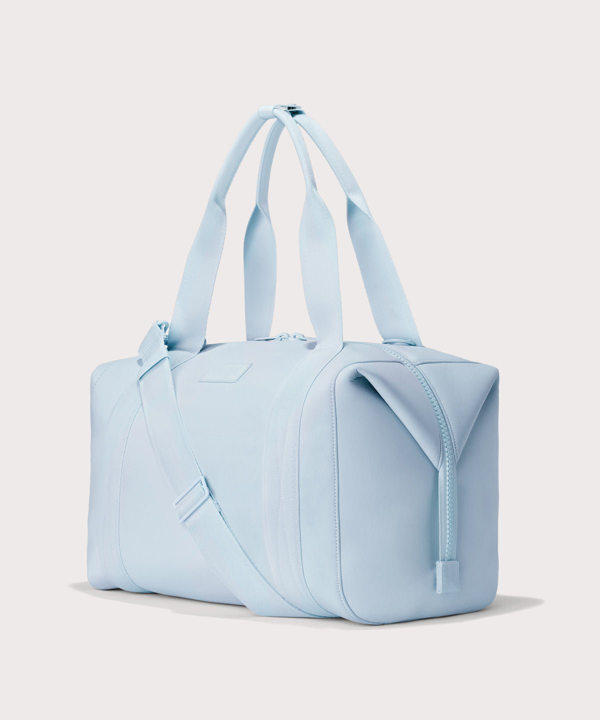 Large Landon Carryall in an airy, lighter sky blue, angle view
