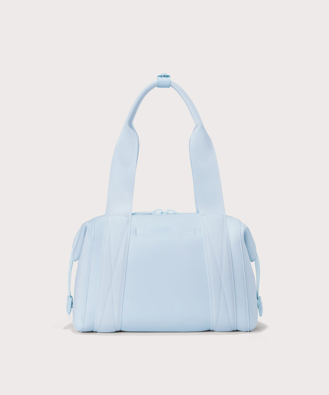 small Landon Carryall in an airy, lighter sky blue, displaying an exterior phone pocket
