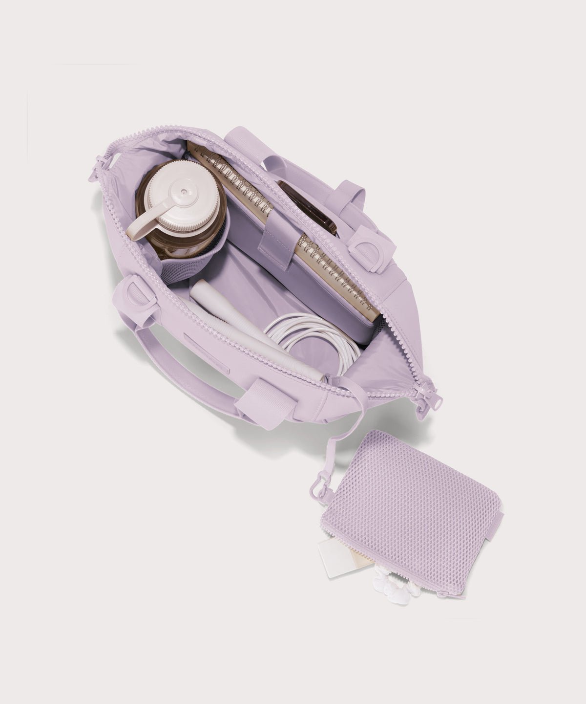 small Landon Carryall in  a soft purple with grey undertones unzipped, top down view