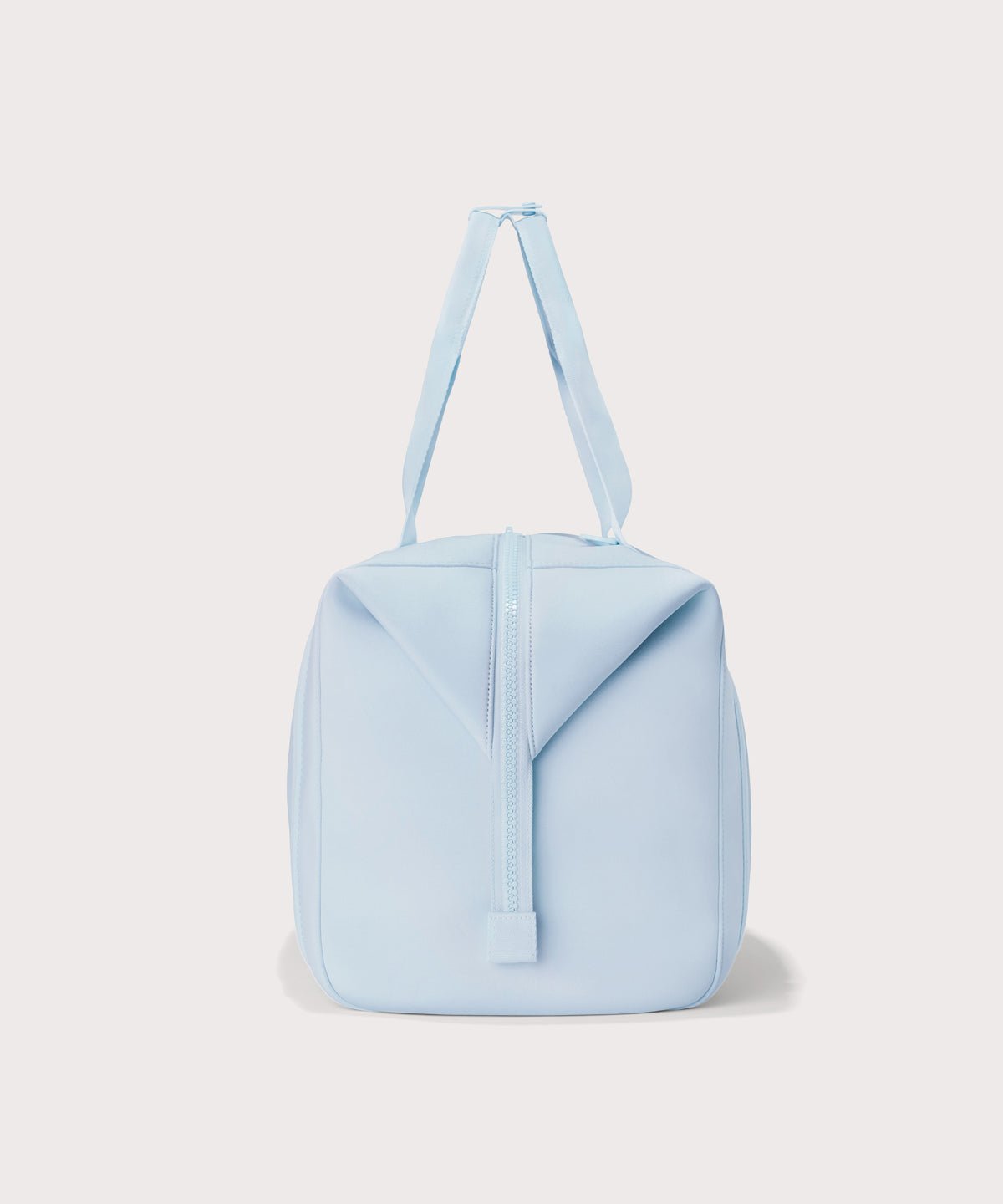 Extra large Landon Carryall in an airy, lighter sky blue with zippers unbuckled
