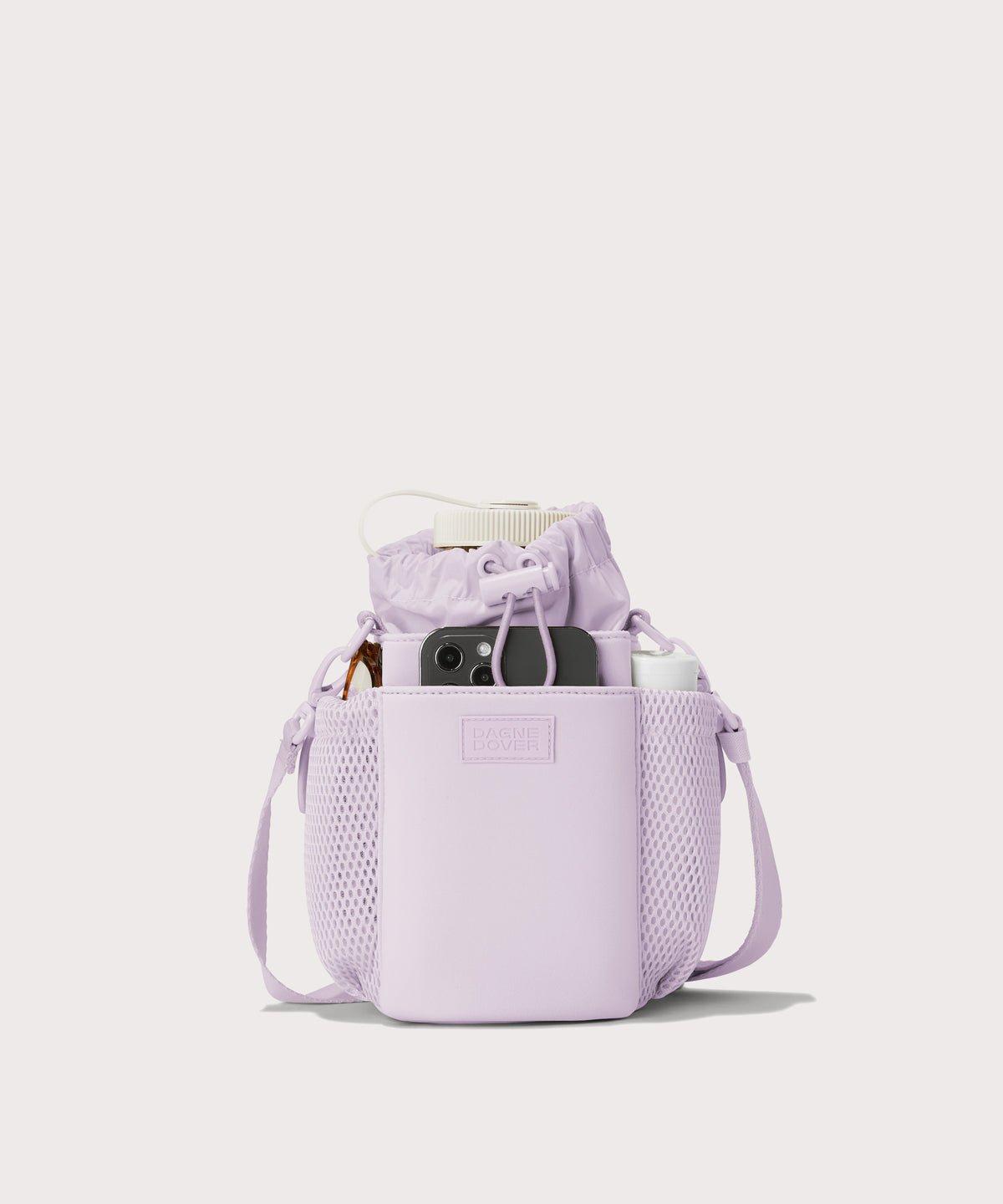 Dagne Dover Sloan Water Bottle Sling in a soft purple with grey undertones  containing a water bottle and accessories.
