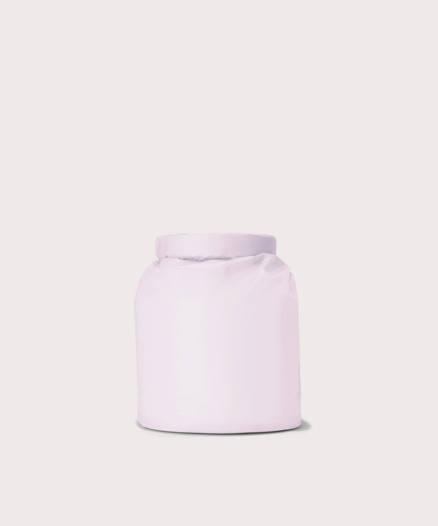 Dagne Dover Rae Roll-Top Dry Bag in a soft purple with grey undertones seen from the back.
