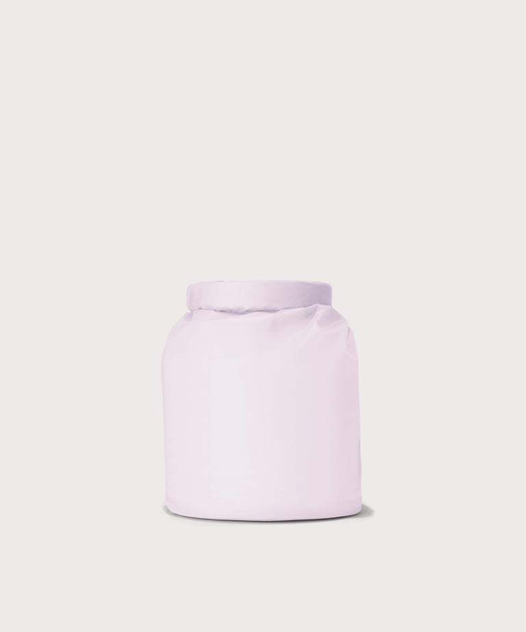 Dagne Dover Rae Roll-Top Dry Bag in a soft purple with grey undertones seen from the back.
