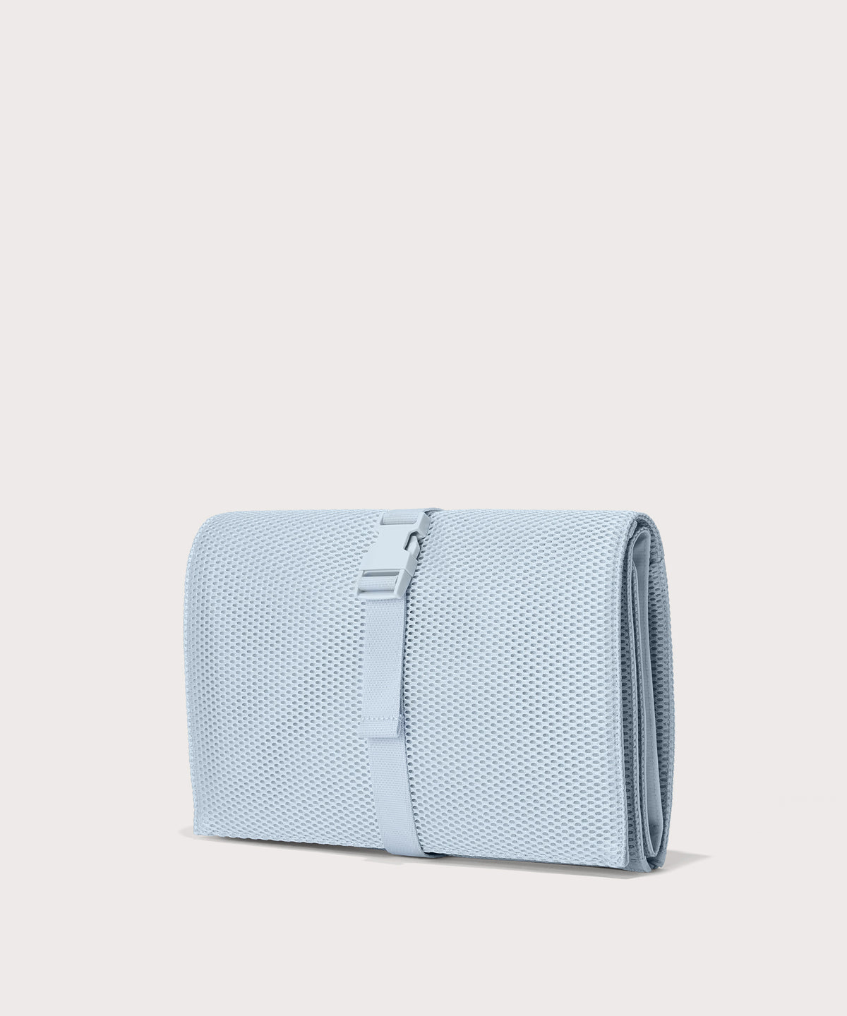 Dagne Dover Joey Changing Kit in an airy, lighter sky blue seen from an angle.
