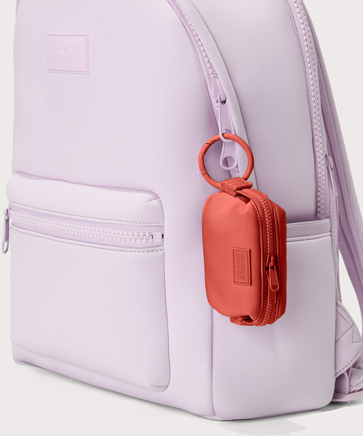 Dagne Dover Hunter Keychain in a poppy, vintage wash red clipped onto a backpack. 