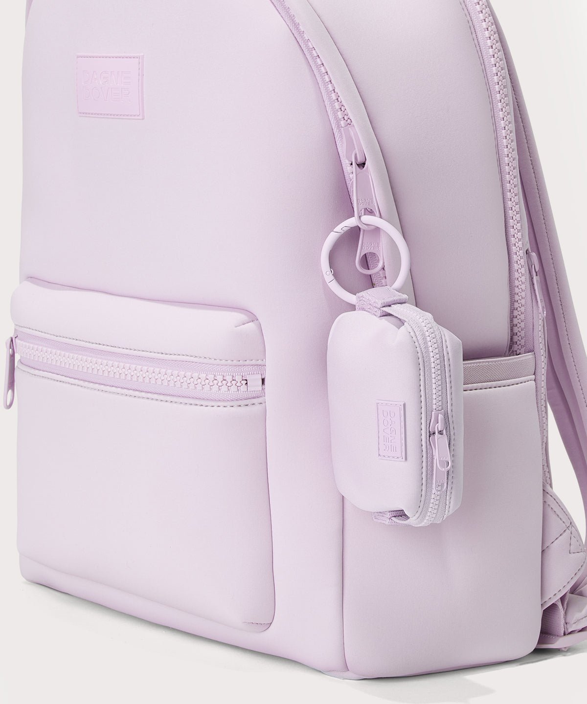 Dagne Dover Hunter Keychain in a soft purple with grey undertones. clipped onto a backpack. 