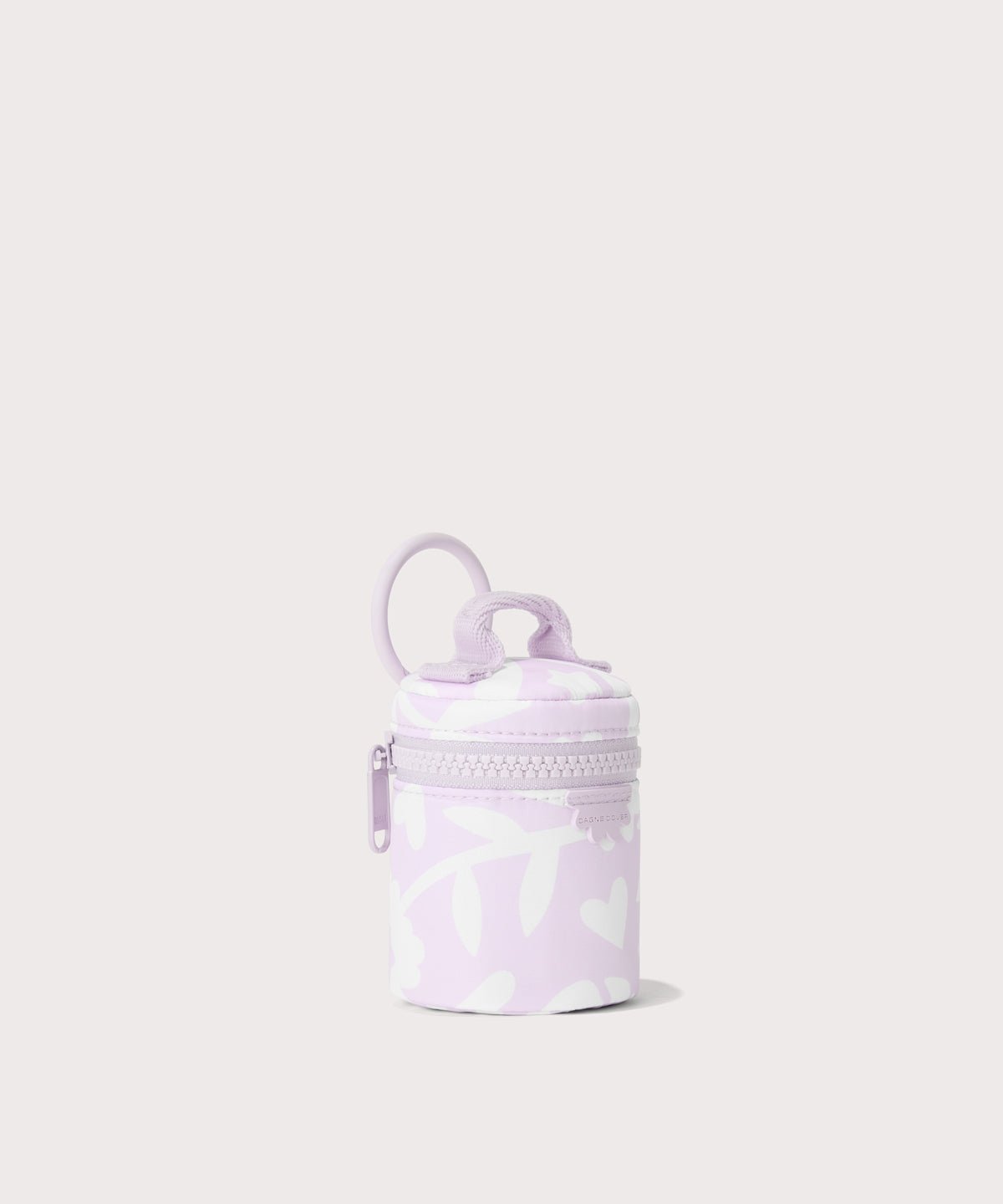 Dagne Dover Mila Keychain in a washed lilac and cream floral print seen from an angle.
