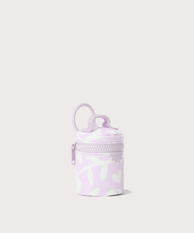 Dagne Dover Mila Keychain in a washed lilac and cream floral print seen from an angle.
