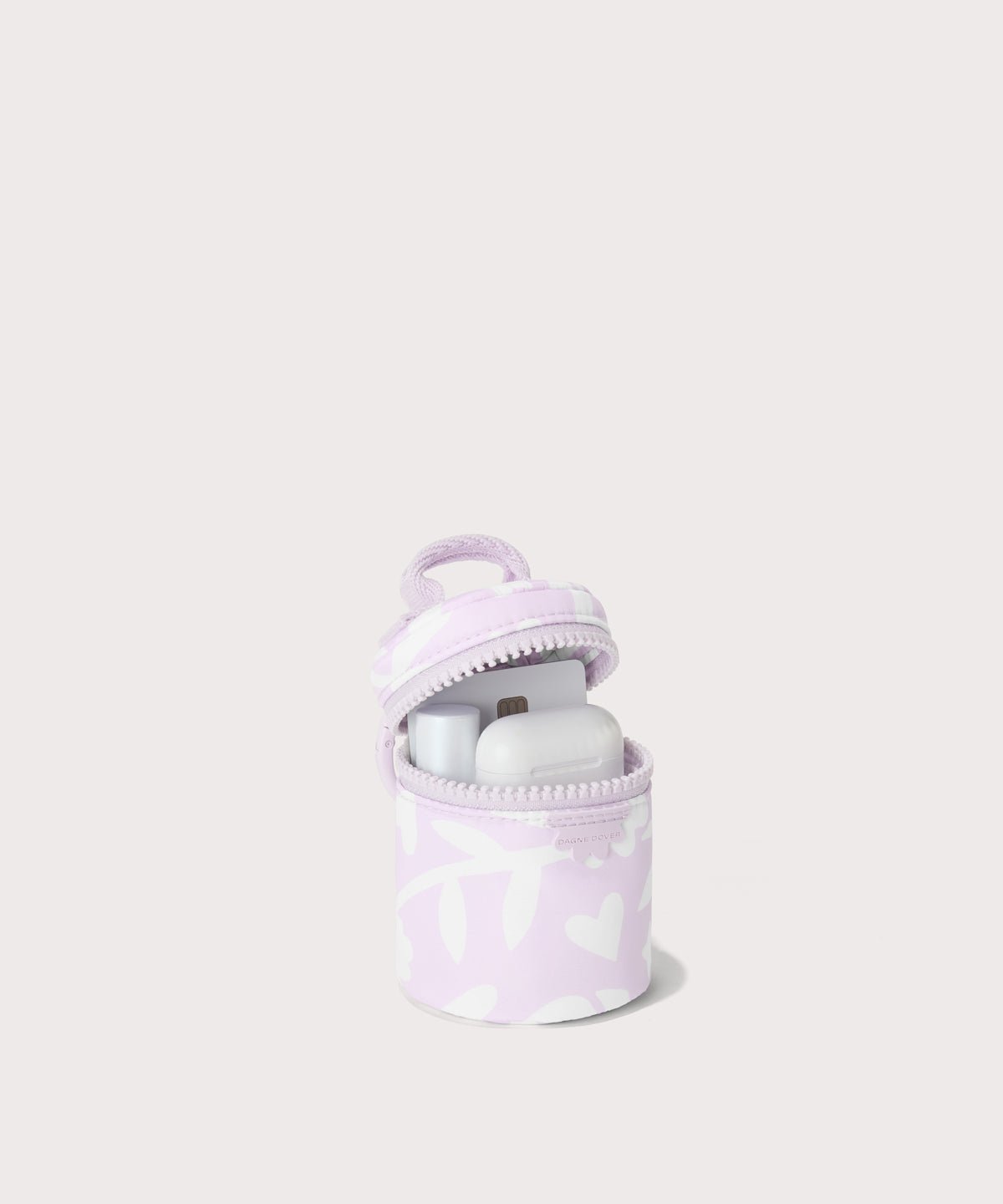 Dagne Dover Mila Keychain in a washed lilac and cream floral print unzipped, showing interior.
