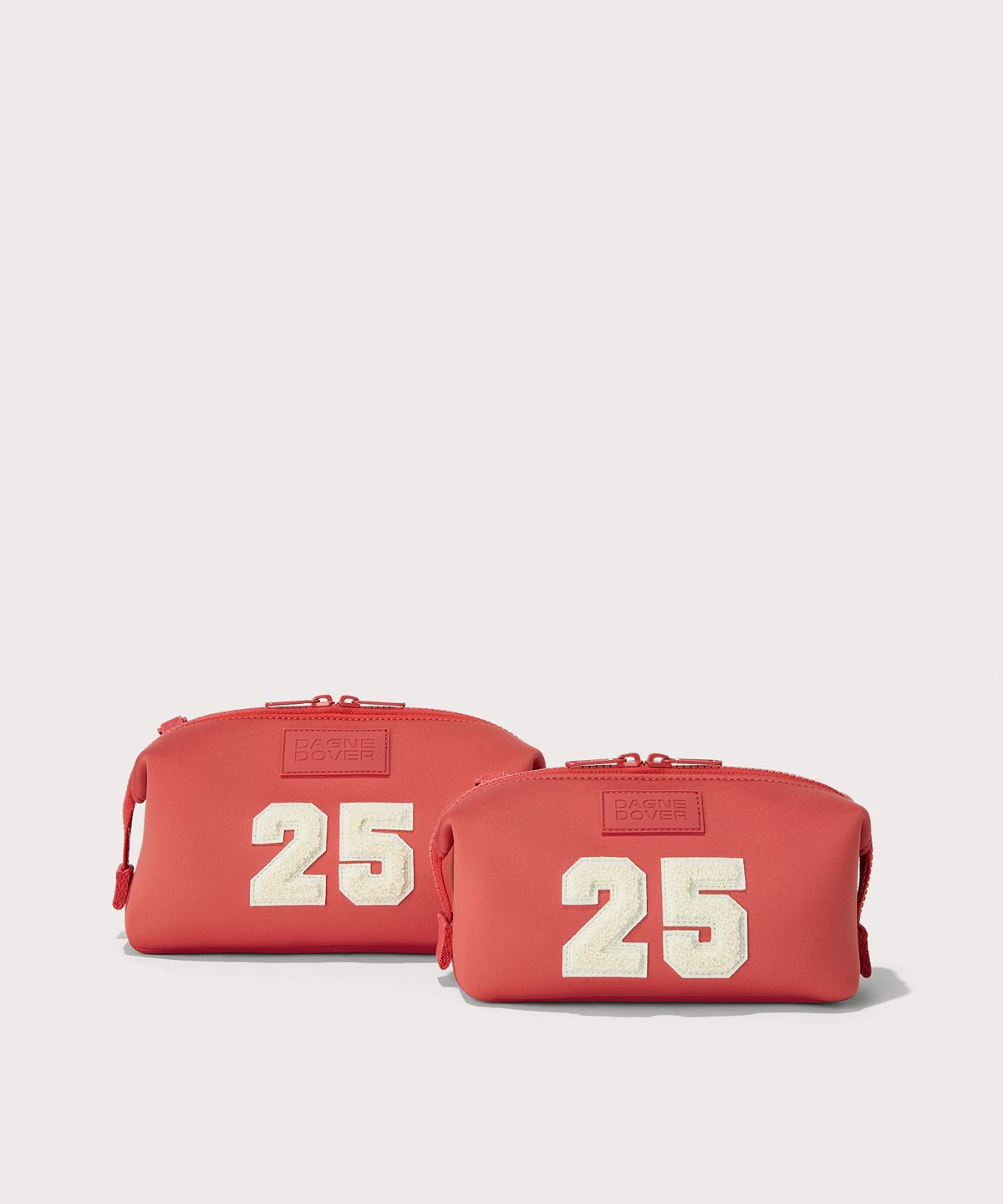 Dagne Dover Small and Large Hunter Toiletry Bags in a poppy, vintage wash red.

