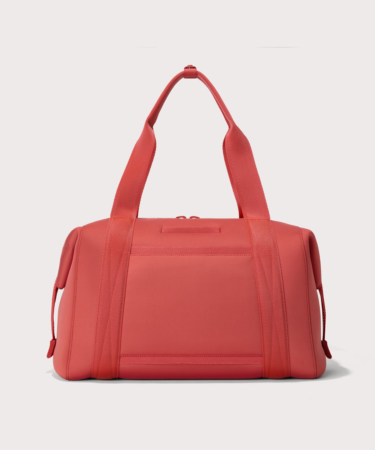 Large Landon Carryall in a poppy, vintage wash red, displaying an exterior phone pocket
