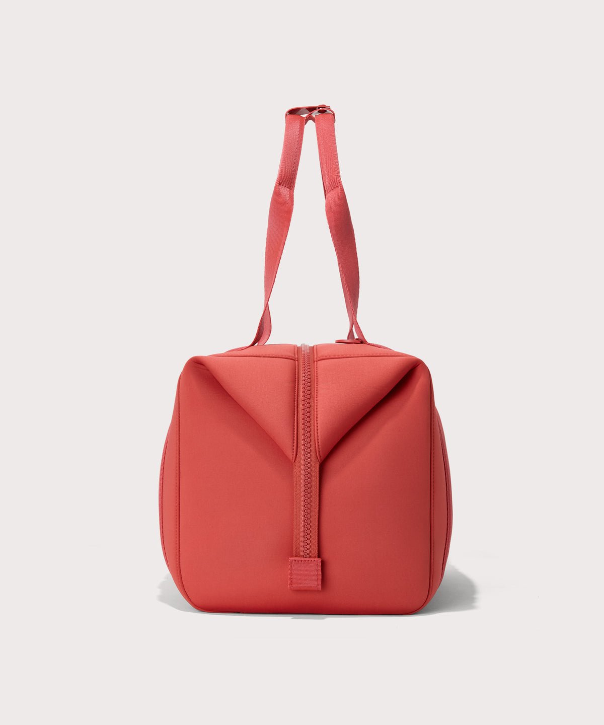 Large Landon Carryall in a poppy, vintage wash red, side view
