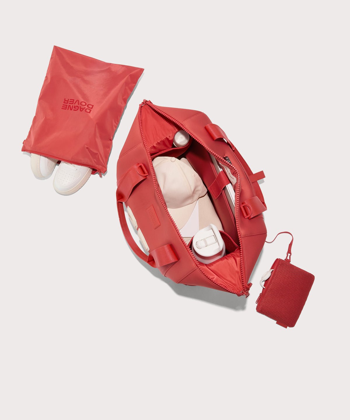 Large Landon Carryall in a poppy, vintage wash red unzipped, top down view