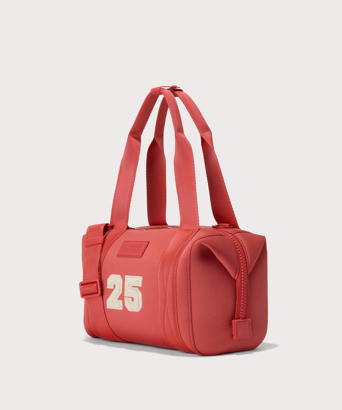 small Landon Carryall in a poppy, vintage wash red, side view
