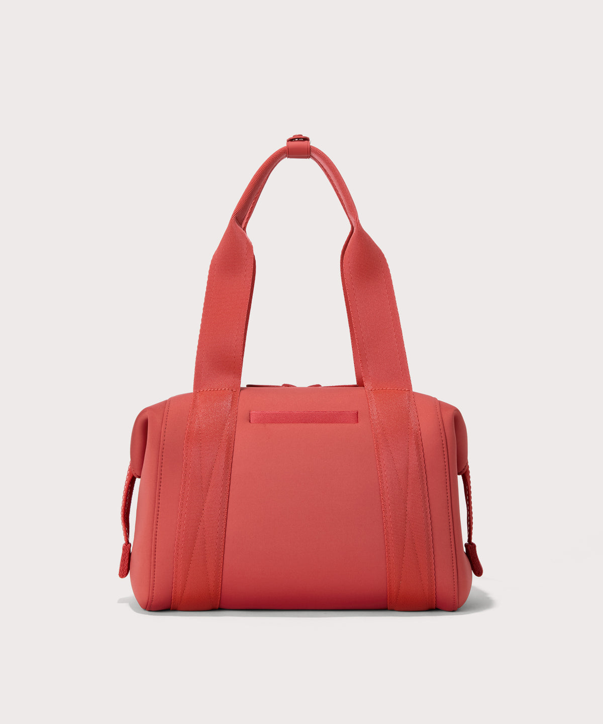 small Landon Carryall in a poppy, vintage wash red, displaying an exterior phone pocket
