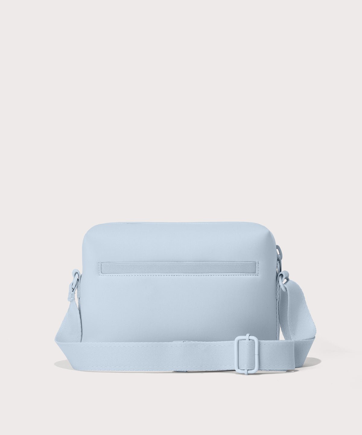 Dagne Dover Micah Crossbody in an airy, lighter sky blue seen from the back.
