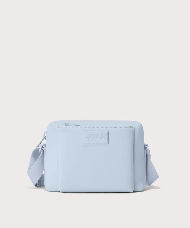 Dagne Dover Micah Crossbody in an airy, lighter sky blue.

