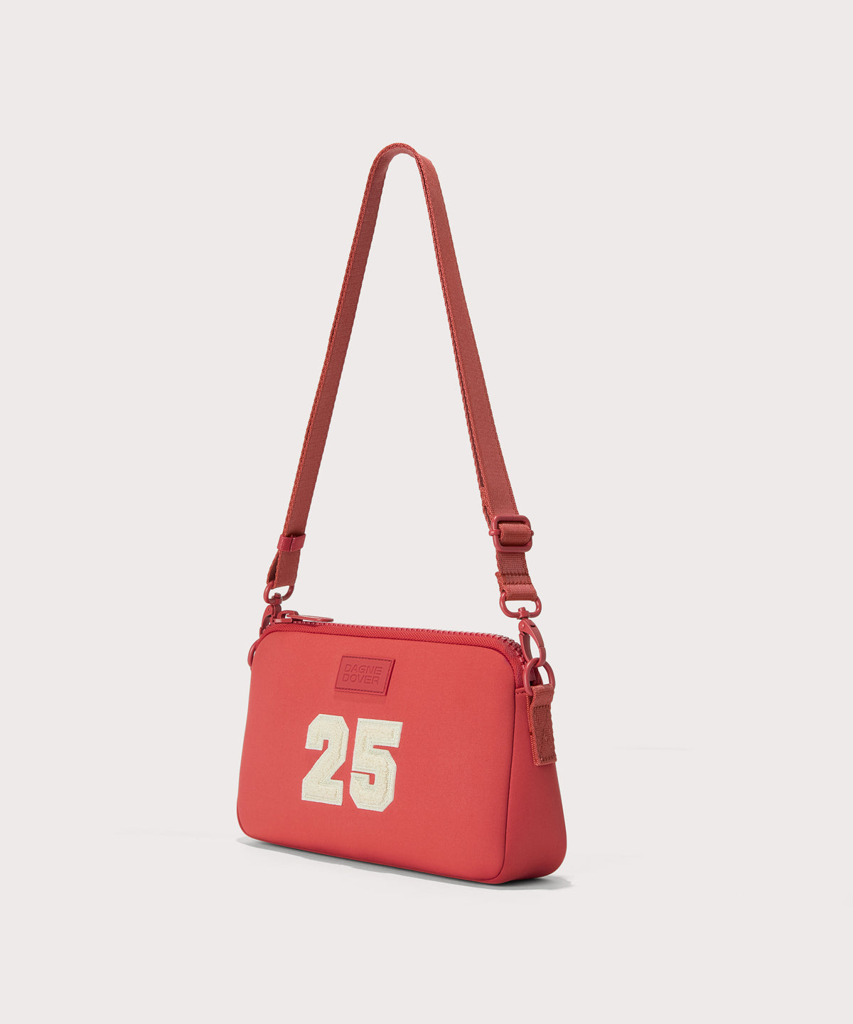 Dagne Dover Nora Shoulder Bag in a poppy, vintage wash red, side angle.
