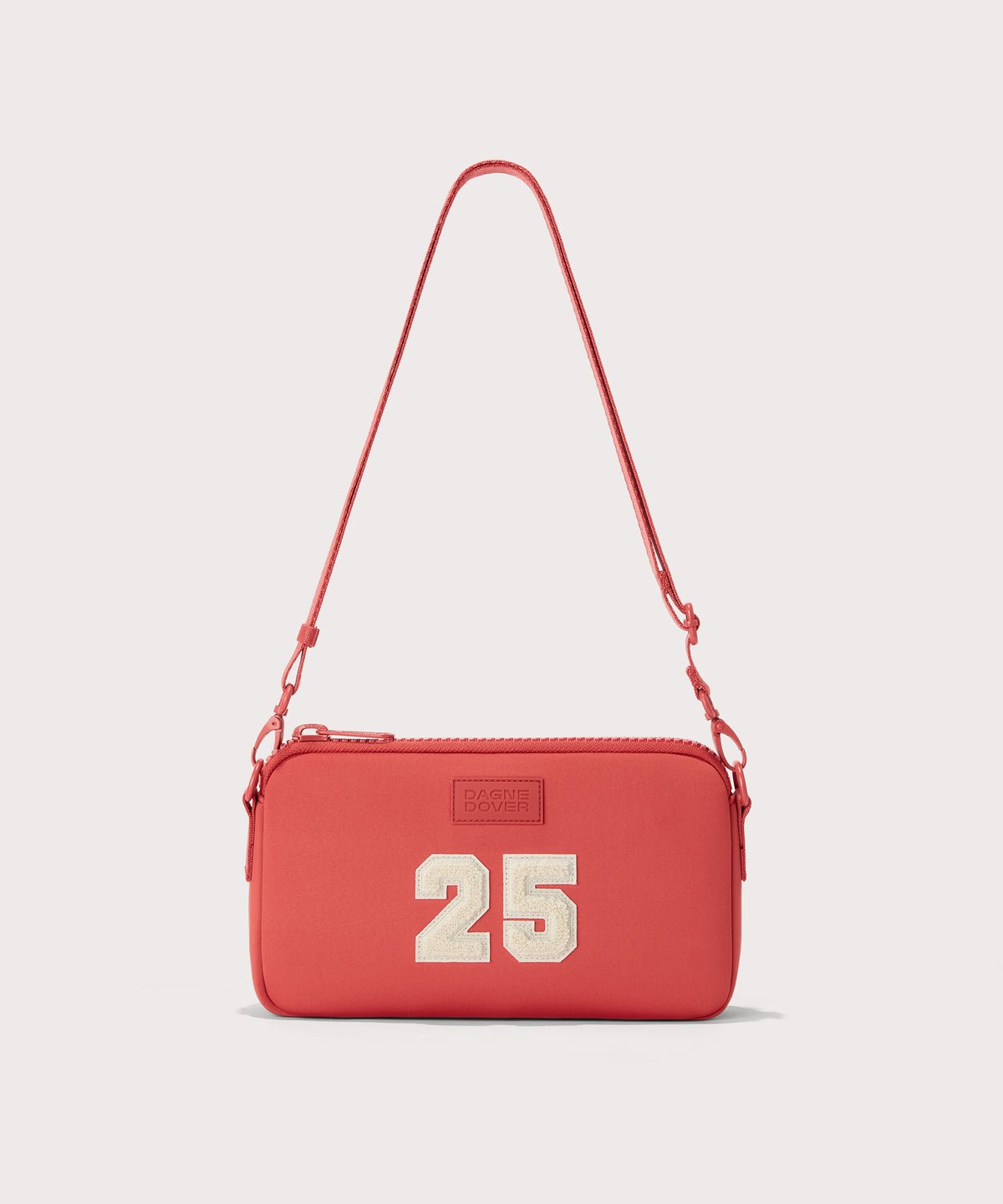 Dagne Dover Nora Shoulder Bag in a poppy, vintage wash red, side angle.
