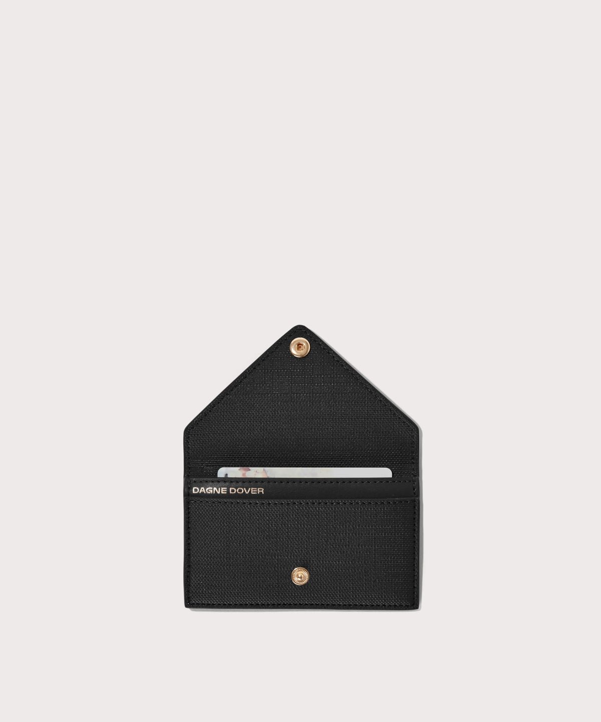Dagne Dover vegan Card Case in black opened revealing the two internal card slots.