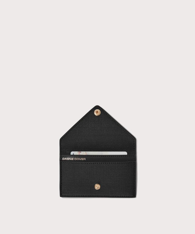 Dagne Dover vegan Card Case in black opened revealing the two internal card slots.