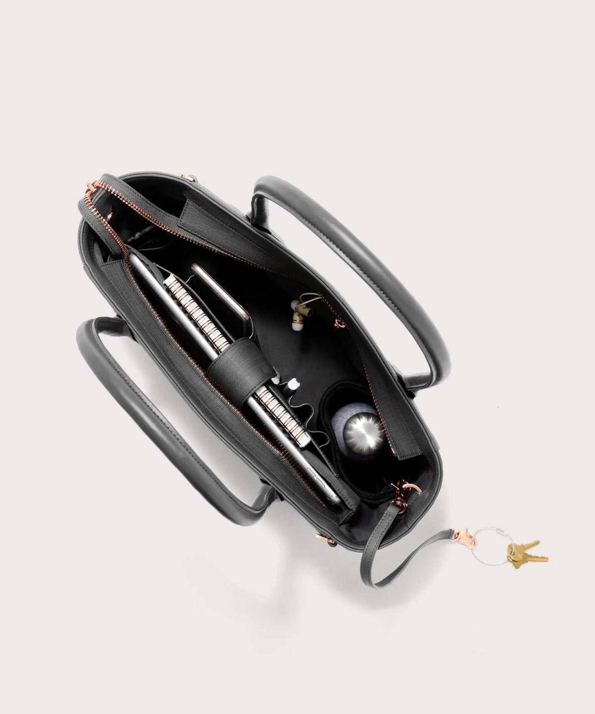 Dagne Dover classic Signature Leather Tote in grey seen from above, revealing 2 slip pockets, the neoprene bottle holder, and large interior zipper pocket.