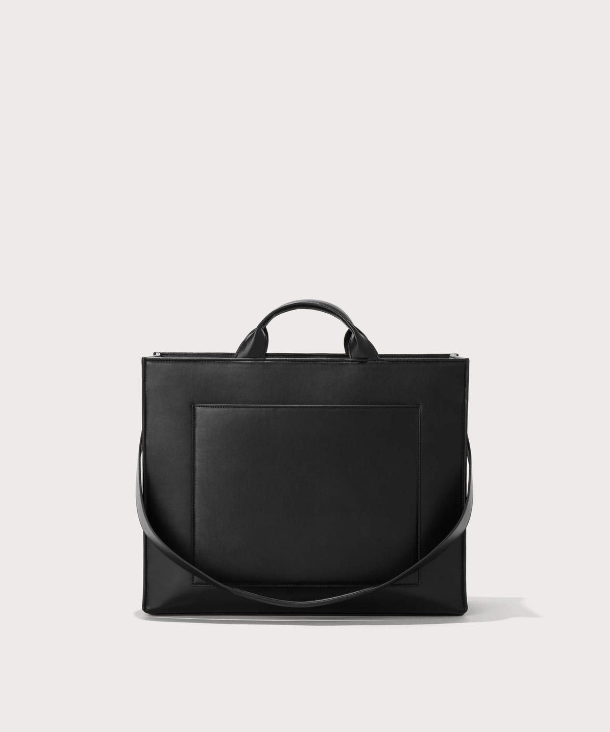 Dagne Dover medium vegan Daily Tote in black with the 11" shoulder strap