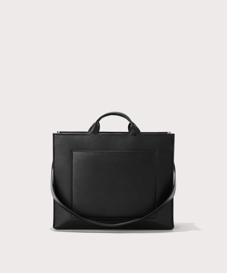 Dagne Dover medium vegan Daily Tote in black with the 11" shoulder strap 
