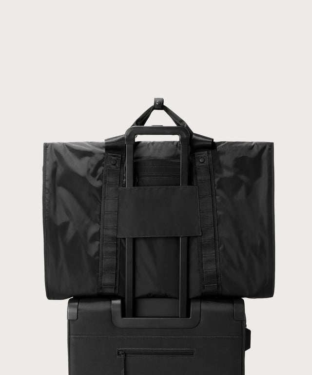 Back view of Capri garment bag in onyx on luggage handle