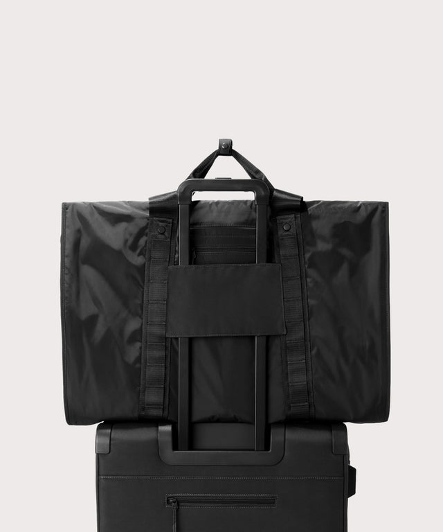 Back view of Capri garment bag in onyx on luggage handle