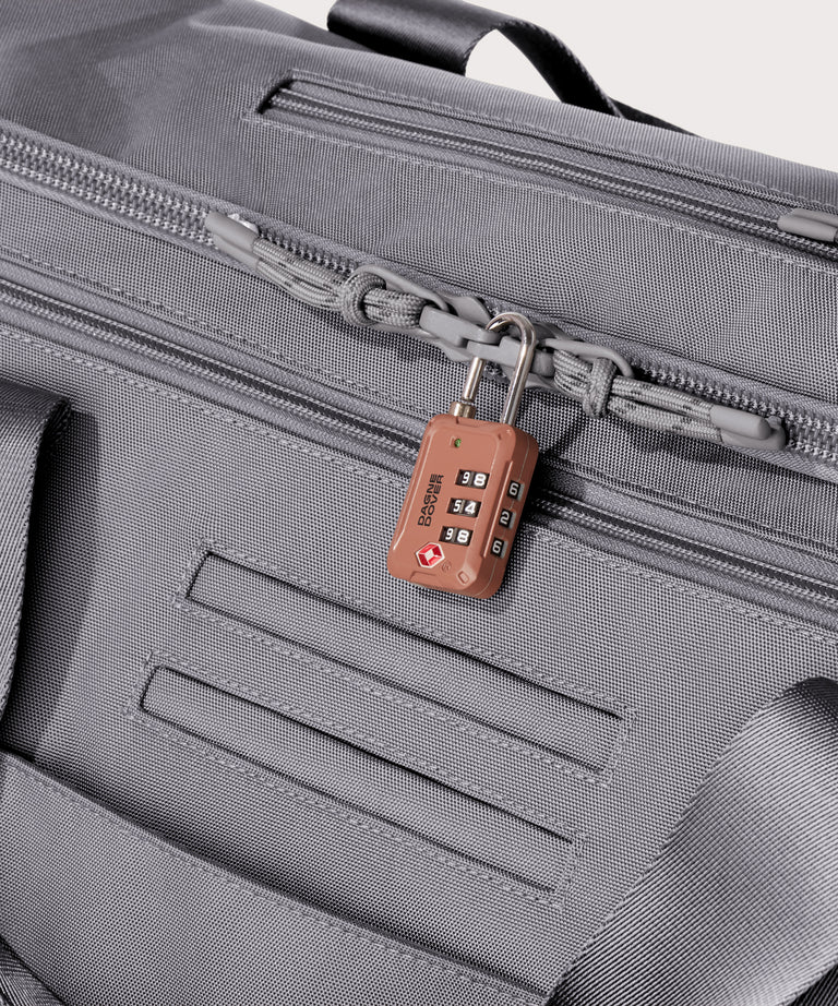 Detail shot of Monaco garment duffle in a light grey lockable zipper heads. Lock not included.

